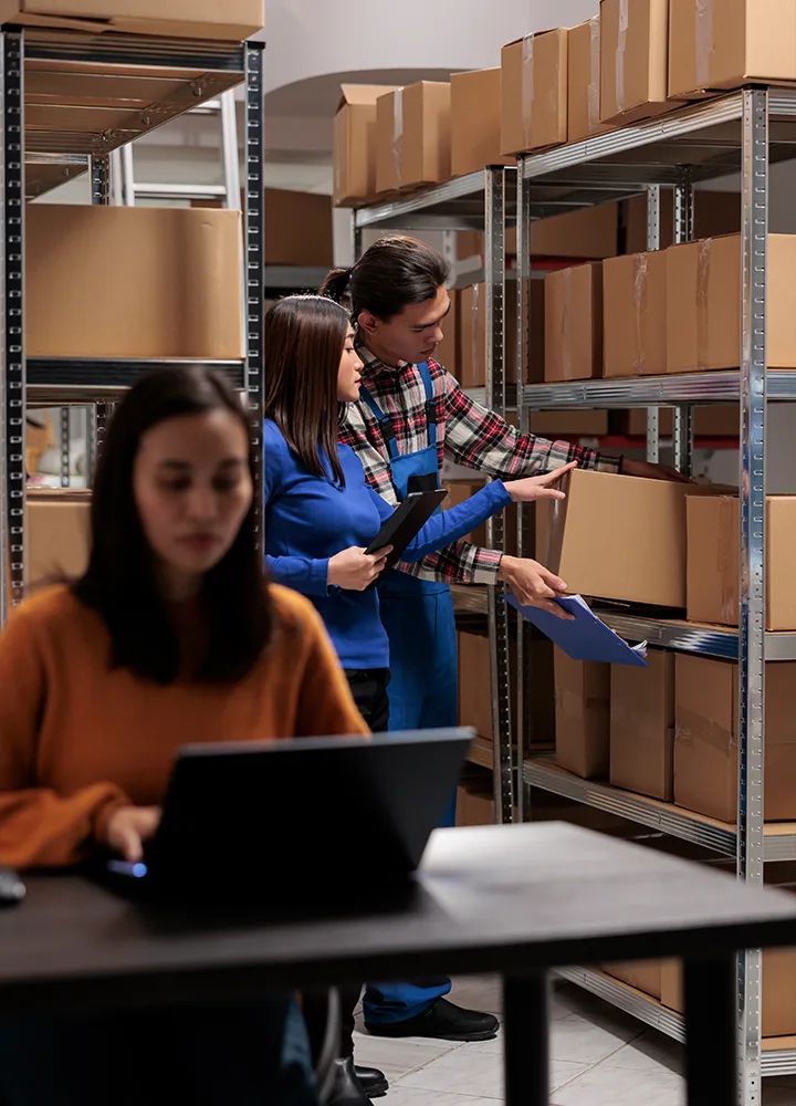 Warehouse team checking stock and documents
